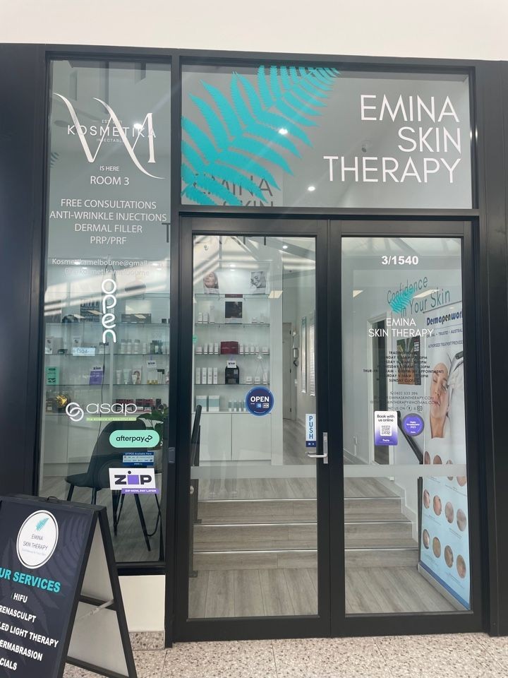 Entrance of Emina Skin Therapy with signage and products displayed inside.