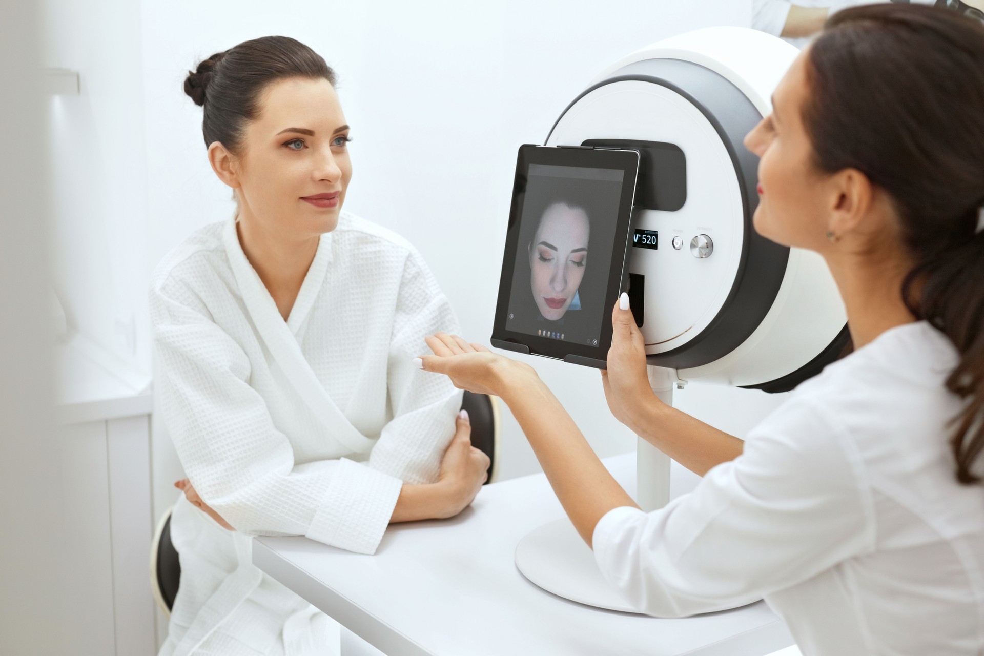 Face Skin Analyze. Cosmetologist Analyzing Woman Facial Skin